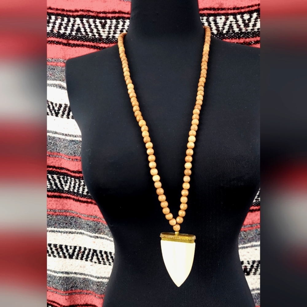 Ox bone arrow shaped pendant with wood bead necklace